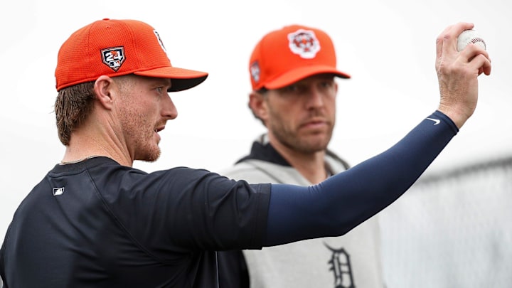 Detroit Tigers pitching coach Chris Fetter talks to pitcher Shelby Miller during spring training.