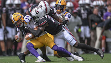 South Carolina linebacker Bam Martin-Scott (22) sacks Louisiana State University quarterback Garrett Nussmeier (13) during the first quarter at Williams-Brice Stadium in Columbia, S.C. Saturday, September 14, 2024.