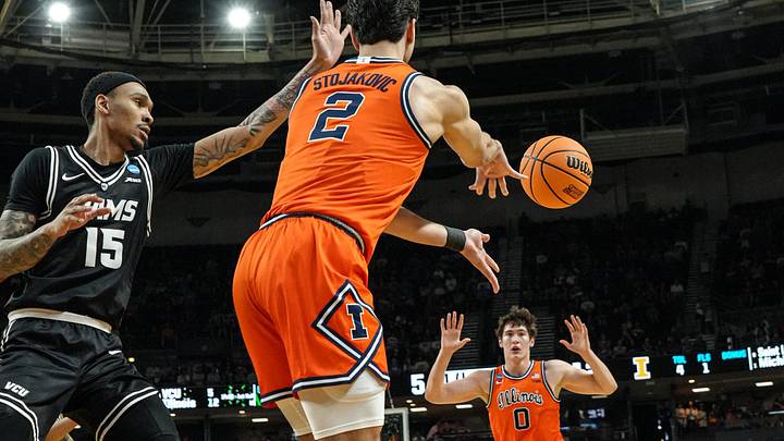 Illinois Fighting Illini guard Andrej Stojakovic (2) passes to forward David Mirkovic (0) near VCU Rams guard Tyrell Ward (15) during the first half of the NCAA Tournament.