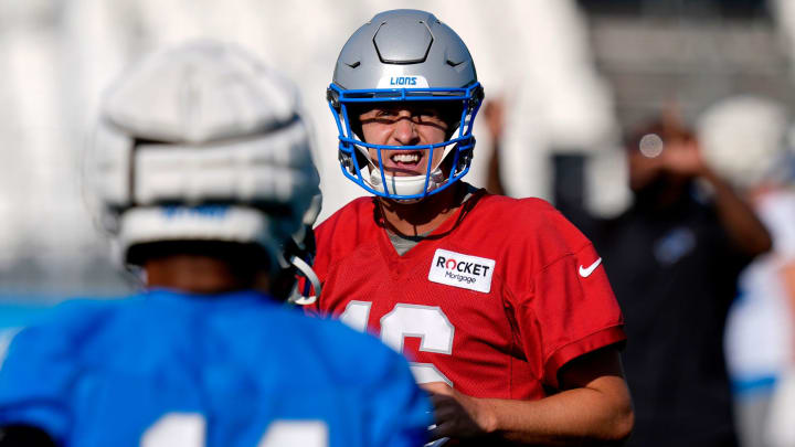 Detroit Lions quarterback Jared Goff talks with wide receiver Amon-Ra St. Brown before the next play during practice at the Detroit Lions practice facility in Allen Park on Friday, July 26, 2024