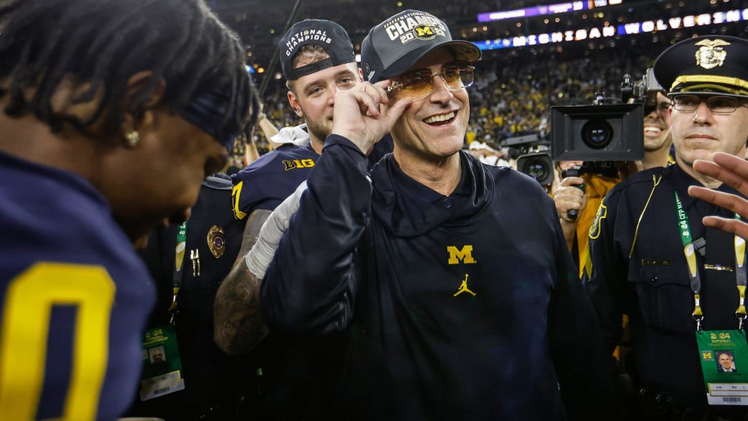 Michigan head coach Jim Harbaugh celebrate after 34-13 win over Washington to win the national championship game at NRG Stadium in Houston on Monday, Jan. 8, 2024.