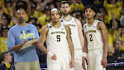 (From left) Michigan coach Juwan Howard, forward Terrance Williams II, center Hunter Dickinson and guard Kobe Bufkin look on during U-M's 60-56 win on Sunday, Jan. 22, 2023, at Crisler Center.

Mich Minn 012223 Kd 1938
