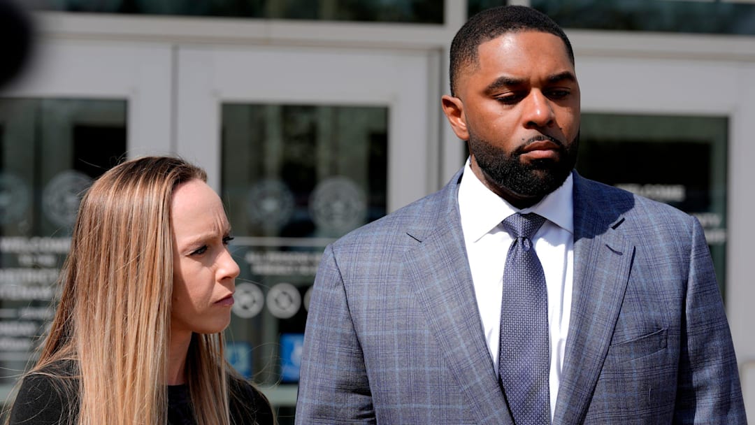 Former University of Michigan football coach Sherrone Moore and his wife Kelli Moore listen to his lawyer, Ellen Michaels, talk to the media after his suspended sentence ruling in the courtroom of Judge J. Cedric Simpson at 14A-1 District Court in Ann Arbor on Tuesday, April, 14, 2026.