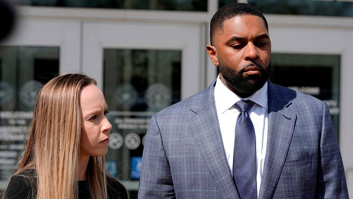 Former University of Michigan football coach Sherrone Moore and his wife Kelli Moore listen to his lawyer, Ellen Michaels, talk to the media after his suspended sentence ruling in the courtroom of Judge J. Cedric Simpson at 14A-1 District Court in Ann Arbor on Tuesday, April, 14, 2026.