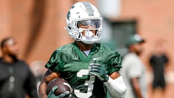 Michigan State's Montorie Foster Jr. runs after a catch during the first day of football camp on Tuesday, July 30, 2024, in East Lansing.
