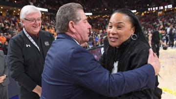 South Carolina basketball coach Dawn Staley celebrating a win with AD Ray Tanner and President Michael Amiridis 