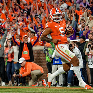 Clemson quarterback D.J. Uiagalelei (5) celebrates scoring a nine-yard touchdown against NC State, during the fourth quarter at Memorial Stadium in Clemson, South Carolina Saturday, October 1, 2022.

Ncaa Football Clemson Football Vs Nc State Wolfpack