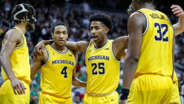 From left, Michigan forward Tray Jackson (2), guard Nimari Burnett (4), guard Jace Howard (25) and forward Tarris Reed Jr. (32) huddle after a play against Michigan State during the second half of MSU's 81-62 win over Michigan on Tuesday, Jan. 30, 2024, in East Lansing.