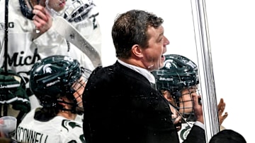 Michigan State's head coach Adam Nightingale calls out to players during the first period against Notre Dame in the Big Ten tournament on Saturday, March 15, 2025, at Muni Arena in East Lansing.