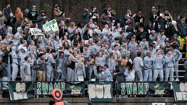 Students in the Dux Swamp cheer on their team after a touchdown against DeWitt Saturday, Nov. 23, 2024. Zeeland West won 32-20 and are going to Ford Field for the championship game.