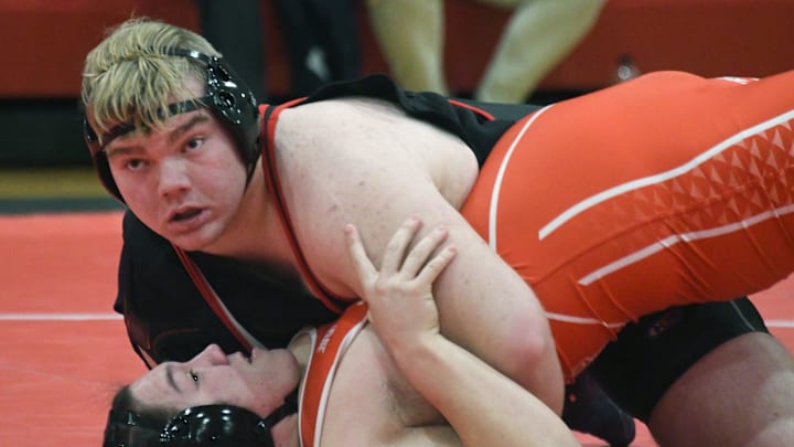 Bedford's Chase Norbury pins Monroe's Brady Kay at 285 pounds during a 66-3 Bedford win on Thursday, Jan. 9, 2025. Bedford's Chase Norbury pins Monroe's Brady Kay at 285 pounds during a 66-3 Bedford win on Thursday, Jan. 9, 2025.