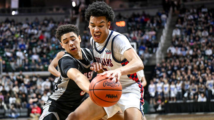 Orchard Lake St. Mary's freshman guard Mateen Cleaves Jr. defends East Lansing's Cam Hutson during the second quarter in the Division 1 state semifinal on March 14, 2025, at the Breslin Center in East Lansing.