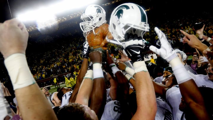 Michigan State players celebrate by raising the Paul Bunyan trophy, which has a Spartan helmet on, after defeating Michigan, 14-10, at Michigan Stadium in Ann Arbor on Oct. 7, 2017.

Paul Bunyan trophy