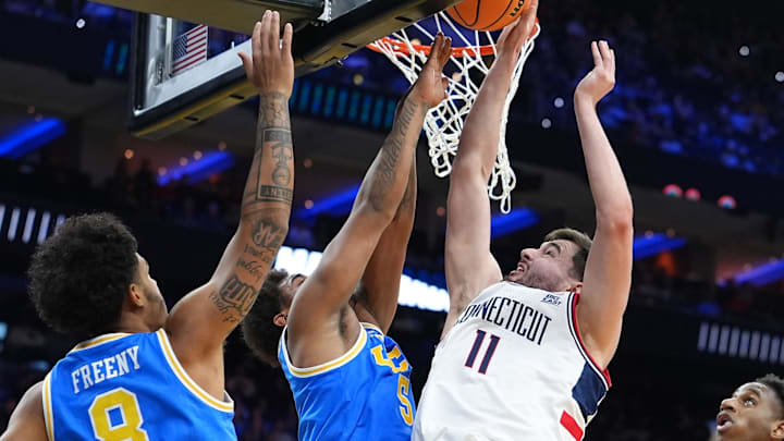 Mar 22, 2026; Philadelphia, PA, USA; UConn Huskies forward Alex Karaban (11) shoots the ball against UCLA Bruins guard Brandon Williams (5) in the second half during a second round game of the men's 2026 NCAA Tournament at Xfinity Mobile Arena. Mandatory Credit: Kyle Ross-Imagn Images