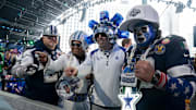 Dallas Cowboys fans pose in the main theater for the first day of the 2024 NFL Draft in Detroit. 