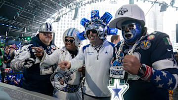 Dallas Cowboys fans pose in the main theater for the first day of the 2024 NFL Draft in Detroit. 