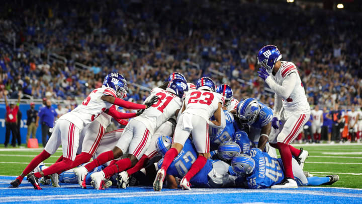 Detroit Lions quarterback Adrian Martinez (18) runs for a touchdown against New York Giants during the second half of a preseason game at Ford Field in Detroit on Friday, Aug. 11, 2023.