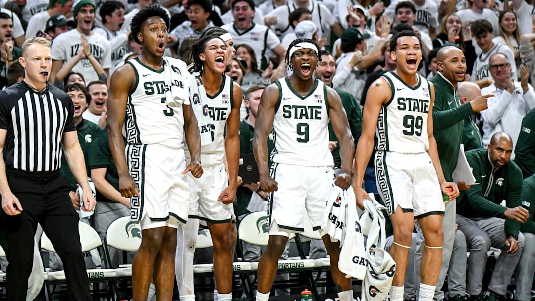 From left, Michigan State's Cam Ward, Jordan Scott, Trey Fort and Divine Ugochukwu celebrate after Coen Carr's dunk against Colgate during the second half on Monday, Nov. 3, 2025, at the Breslin Center in East Lansing.