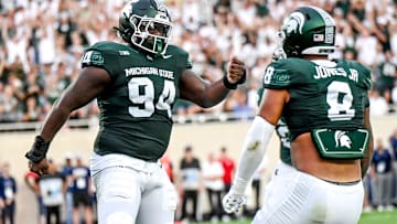 Michigan State's D'Quan Douse, left, celebrates his safety with teammate Anthony Jones during the first quarter in the game against Florida Atlantic on Friday, Aug. 30, 2024, at Spartan Stadium in East Lansing.