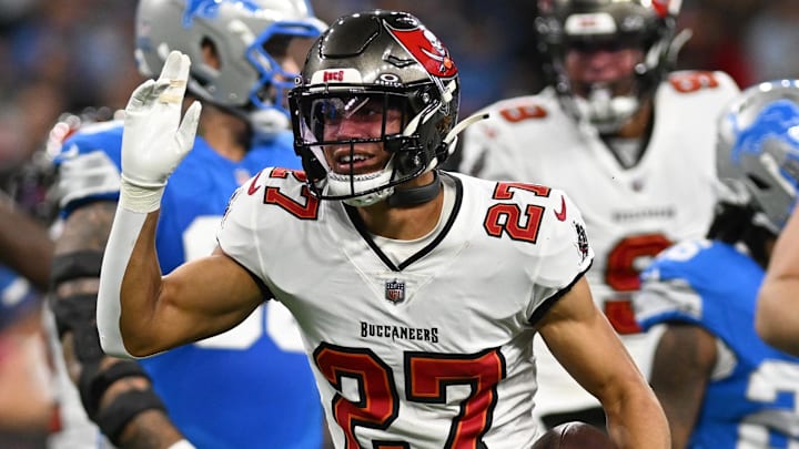 Sep 15, 2024; Detroit, Michigan, USA;  Tampa Bay Buccaneers cornerback Zyon McCollum (27) celebrates after interception Detroit Lions quarterback Jared Goff (16) on the Lions first offensive play of the game in the  first quarter at Ford Field. Mandatory Credit: Lon Horwedel-Imagn Images