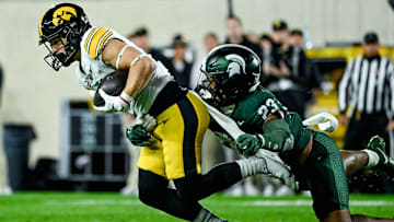 Michigan State's Darius Snow, right, tackles Iowa's Kaden Wetjen in the first quarter on Saturday, Oct. 19, 2024, at Spartan Stadium in East Lansing.