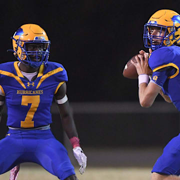 Wren freshman Mason Holtzclaw (9) passes near Wren senior Travon West (7) playing Palmetto during third quarter at Wren High in Piedmont, S.C. Friday, October 14, 2022.

Palmetto At Wren Hs Football