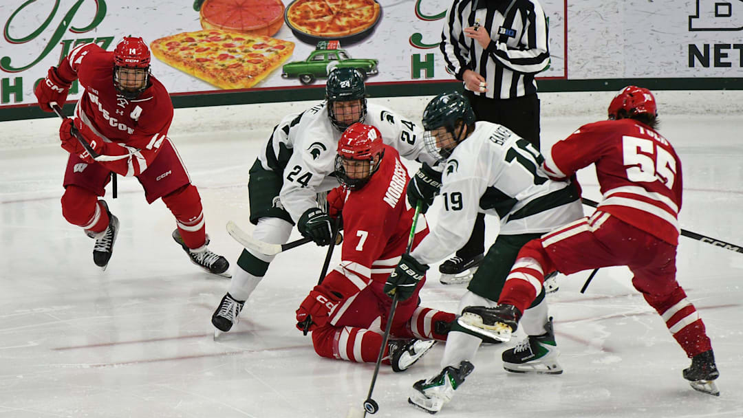 Michigan State and Wisconsin go after the puck in Big Ten action at Munn Arena Saturday, Nov. 22, 2025.