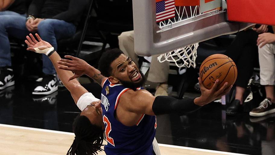 New York Knicks center Karl-Anthony Towns shoots the ball against the San Antonio Spurs.