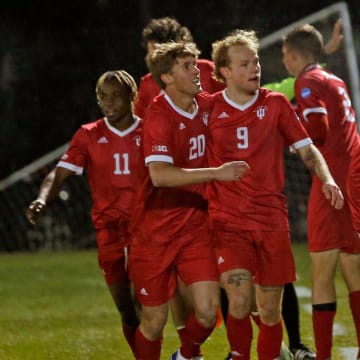 Indiana players celebrate after junior Patrick McDonald (22) scored to tie the game in the second half of an NCAA Tournament men's soccer quarterfinal game against Notre Dame Saturday, Dec. 2, 2023, at Alumni Stadium in South Bend. Also pictured is Collins Oduro (11), Clay Murador (20), Sam Sarver (9) and Joey Maher (2). Of those Hoosiers, all but Maher return in 2024.