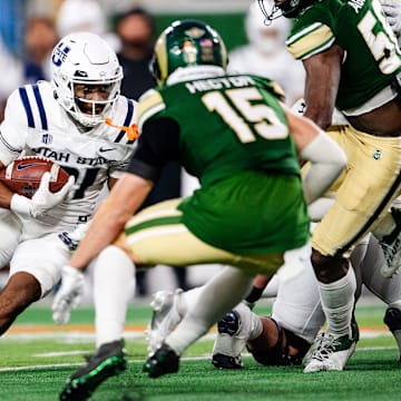 Utah State's Herschel Turner takes the ball during a game against CSU on Friday, Nov. 29, 2024 in Fort Collns, Colo.