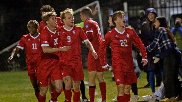 Indiana players celebrate after junior Patrick McDonald (22) scored to tie the game in the second half of an NCAA Tournament men's soccer quarterfinal game against Notre Dame Saturday, Dec. 2, 2023, at Alumni Stadium in South Bend. Also pictured is Collins Oduro (11), Clay Murador (20), Sam Sarver (9) and Joey Maher (2). Of those Hoosiers, all but Maher return in 2024.