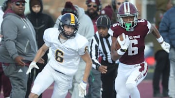 Harper Woods receiver Dakota Guerrant runs by Airport High School Colin Nowak for a touchdown during first half action at Harper Woods High School on Saturday, Nov 11, 2023.