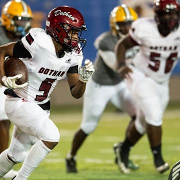 Dothan's Tamarion Peterson (5) runs the ball at Cramton Bowl in Montgomery, Ala., on Thursday, Oct. 27, 2022. Dothan leads Jeff Davis 31-6 at halftime.