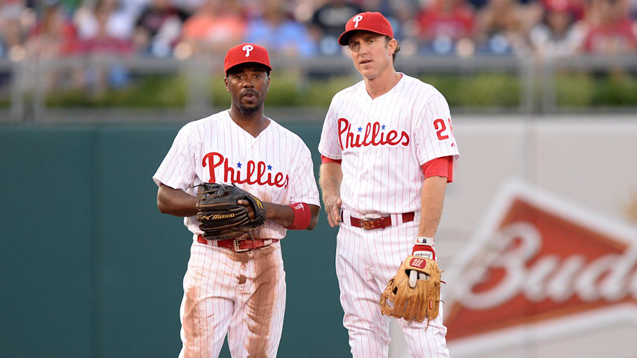 Jimmy Rollins, left, and Chase Utley of the Philadelphia Phillies talk on the field