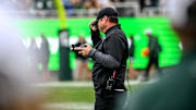 Michigan State's head coach Jonathan Smith adjusts his hat on the sideline during the fourth quarter in the game against UCLA on Saturday, Oct. 11, 2025, at Spartan Stadium in East Lansing.