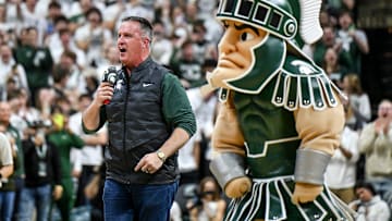 Michigan State's new football coach Pat Fitzgerald addresses the crowd during a timeout in the first half of the Spartans basketball game against Iowa on Tuesday, Dec. 2, 2025, at the Breslin Center in East Lansing.