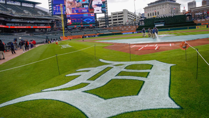 Detroit Tigers head groundskeeper Heather Nabozny prepares the infield with her crew before the Detroit Tigers take on the Oakland Athletics for the Detroit home opener at Comerica Park on Friday, April 5, 2024. Take a look at the new scoreboard in the background.