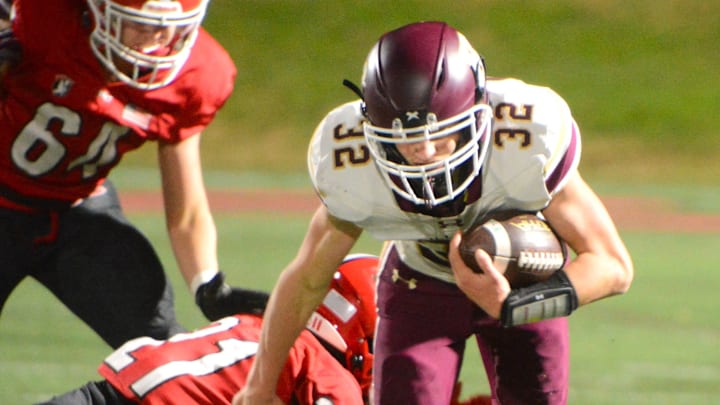 Hayden Allard looks for some running room against New Canaan during the Class L quarterfinals Tuesday at Dunning Field.