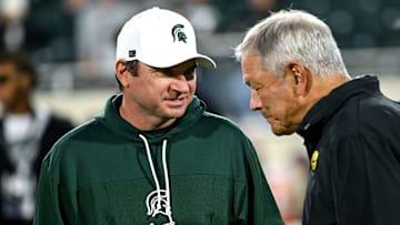 Michigan State head coach Jonathan Smith talks with Iowa head coach Kirk Ferentz before the game Saturday, Oct. 19, 2024, at Spartan Stadium in East Lansing.