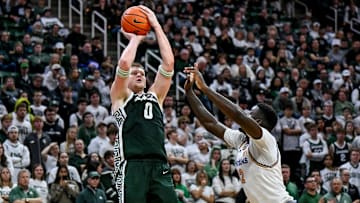 Michigan State's Jaxon Kohler, left, scores against San Jose State's Yaphet Moundi during the second half on Thursday, Nov. 13, 2025, at the Breslin Center in East Lansing.