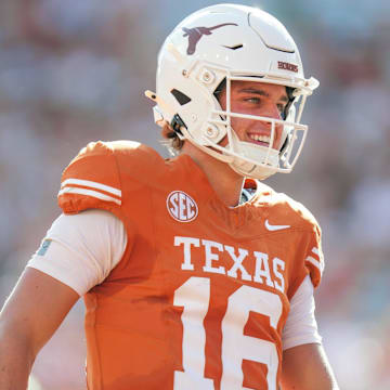 Texas Longhorns quarterback Arch Manning (16) smiles after scoring a touch down as the Texas Longhorns take on Colorado State at Darrell K Royal-Texas Memorial Stadium in Austin Saturday, Aug. 31, 2024.