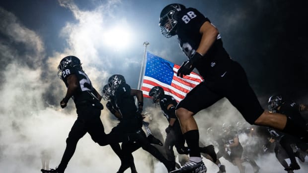 The Vandegrift football team take the field ahead of the state championship playoff game against Lake Travis at Vandegrift.