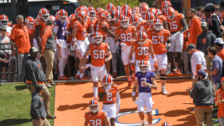 Clemson quarterback Cade Klubnik (2) and teammates run down the hill before the Spring football game in Clemson, S.C. Saturday, April 6, 2024.