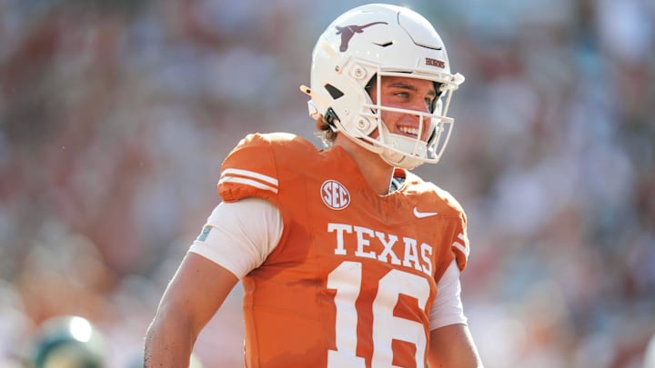 Texas Longhorns quarterback Arch Manning (16) smiles after scoring a touch down as the Texas Longhorns take on Colorado State at Darrell K Royal-Texas Memorial Stadium in Austin Saturday, Aug. 31, 2024.