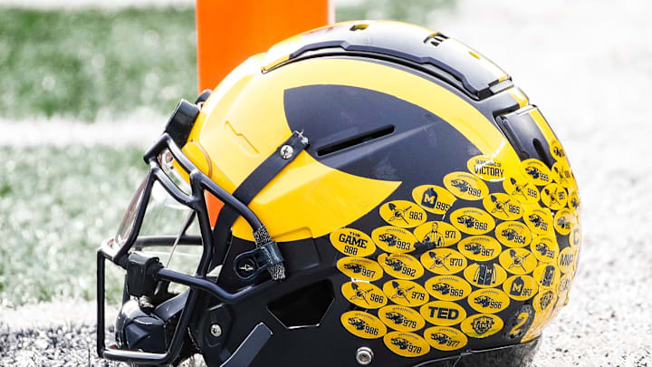 Michigan running back Blake Corum's helmet sits on the turf during warmups before the Ohio State game at Michigan Stadium in Ann Arbor on Saturday, Nov. 25, 2023.