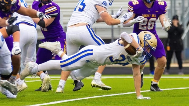 Alamo Heights' Bennett Flesher (34) jets across the goal line against Liberty Hill in the 5A Division playoffs in Nov. 2022.