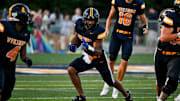 Haslett's Kory Amachree runs for a gain against DeWitt during the second quarter on Thursday, Aug. 29, 2024, at Haslett High School.