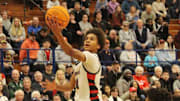 Benet's Brayden Fagbemi drives to the basket for two points in the Redwings' 56-47 semifinal win over Joliet West Friday afternoon.

Ben Fagbemi