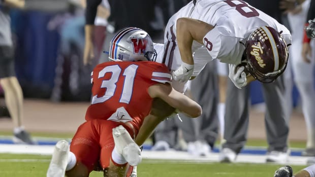 Westlake LB Elliott Schaper tackles Dripping Springs receiver Nick Tyndall during a district game on Oct. 13, 2023.