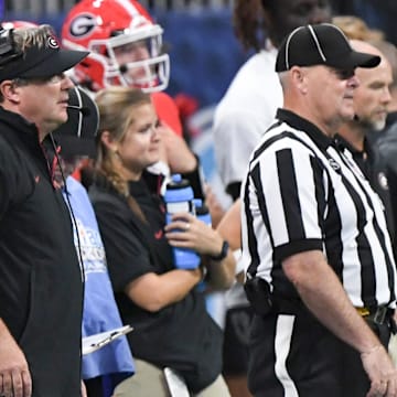 Aug 31, 2024; Atlanta, Georgia, USA; Georgia Bulldogs head coach Kirby Smart looks toward the field as Brandon Streeter stands behind him during the fourth quarter of the 2024 Aflac Kickoff Game against the Clemson Tigers at Mercedes-Benz Stadium. Mandatory Credit: Ken Ruinard-Imagn Images